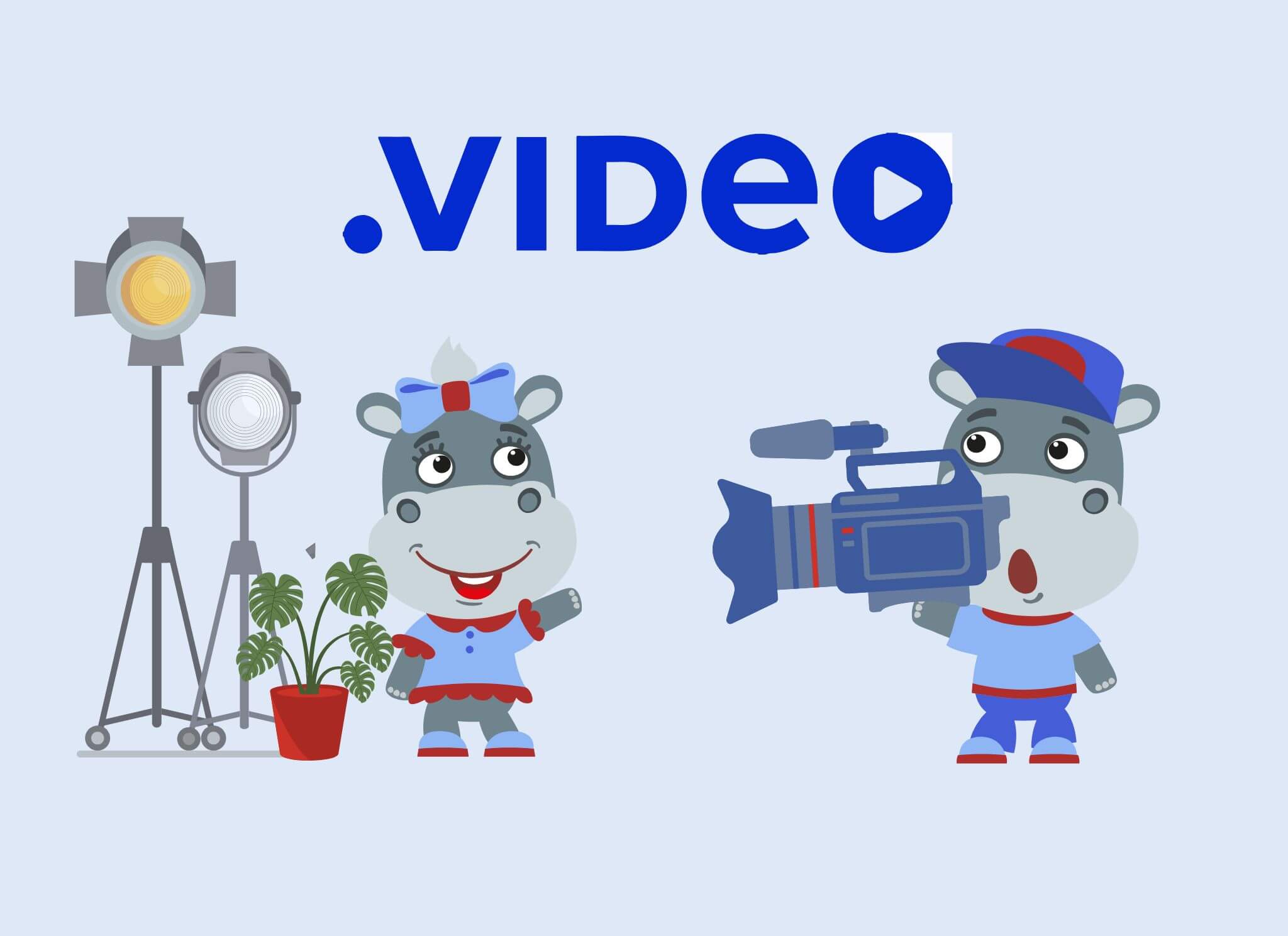 Cartoon hippos in a video production setting. One hippo is operating a professional video camera, while another stands near stage lights, dressed in red and blue. The text '.VIDEO' is displayed above them, with the 'O' stylized as a play button.